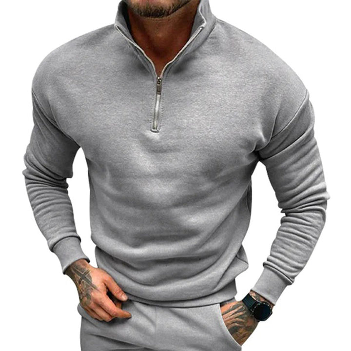 Men's smart casual half-zip knit jumper. Clean, minimalist pullover style, great for versatile layering in autumn.