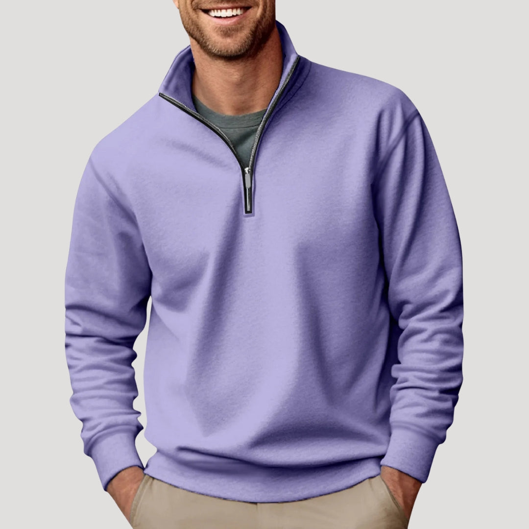 Detail of the quarter zipper on a men's minimalist sweatshirt, highlighting the quality and design