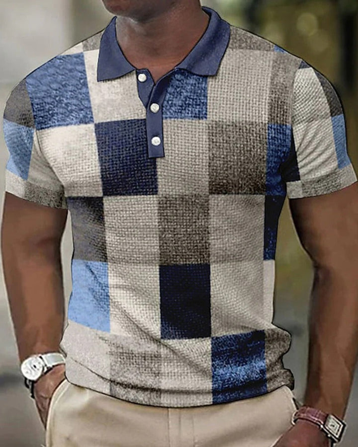 Versatile men's checkered polo shirt in a modern style. Comfortable short-sleeve top for casual or everyday wear.