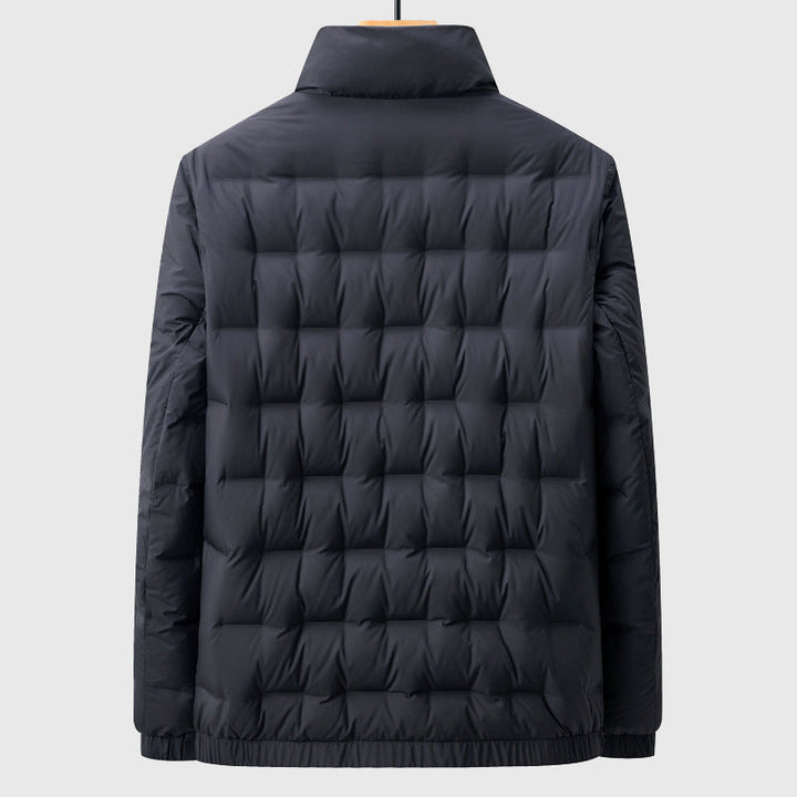 Padded men's quilted jacket, featuring a stand collar for extra warmth. Comfortable and lightweight winter coat.