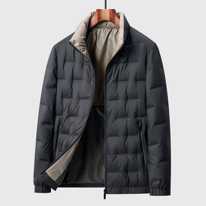 Stylish mens quilted jacket with a sharp stand collar. This casual, padded outerwear is a modern winter coat essential.