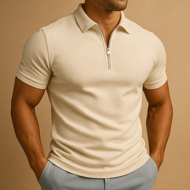 Man models a modern slim fit zip polo shirt. Short sleeve, comfortable, exuding refined smart casual style for everyday wear.