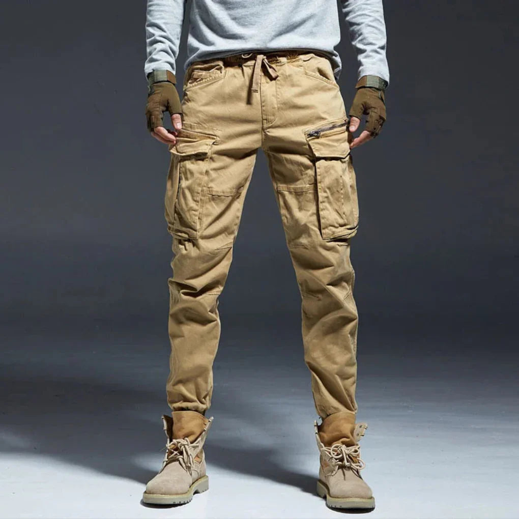 Men's multi-pocket beige cargo pants, comfortable & relaxed fit for everyday casual wear.