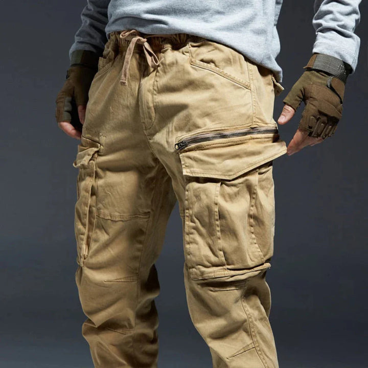 Men's multi-pocket cargo trousers in beige, offering comfort and utility for active lifestyles.