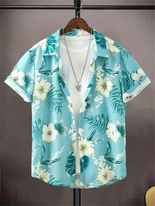 Detail of a button on the men's floral Hawaiian shirt, polyester blend texture visible