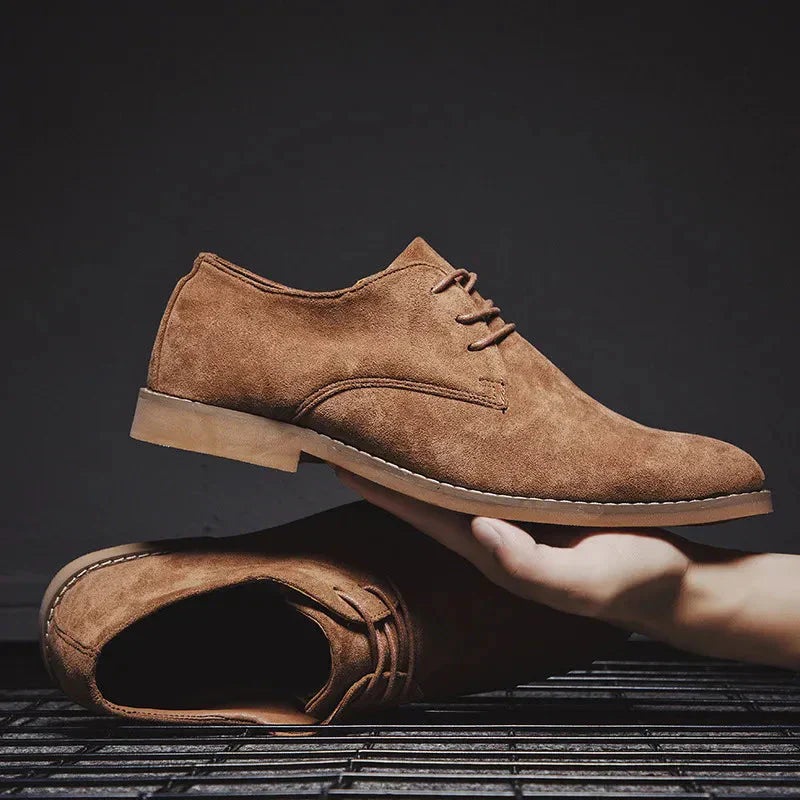Close-up of men's brown suede oxford shoes with classic lace-up detailing