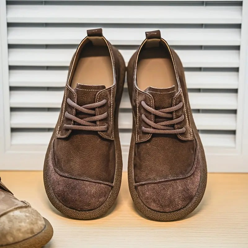 Brown men's orthopedic footwear, leather construction for both style and ergonomic comfort.
