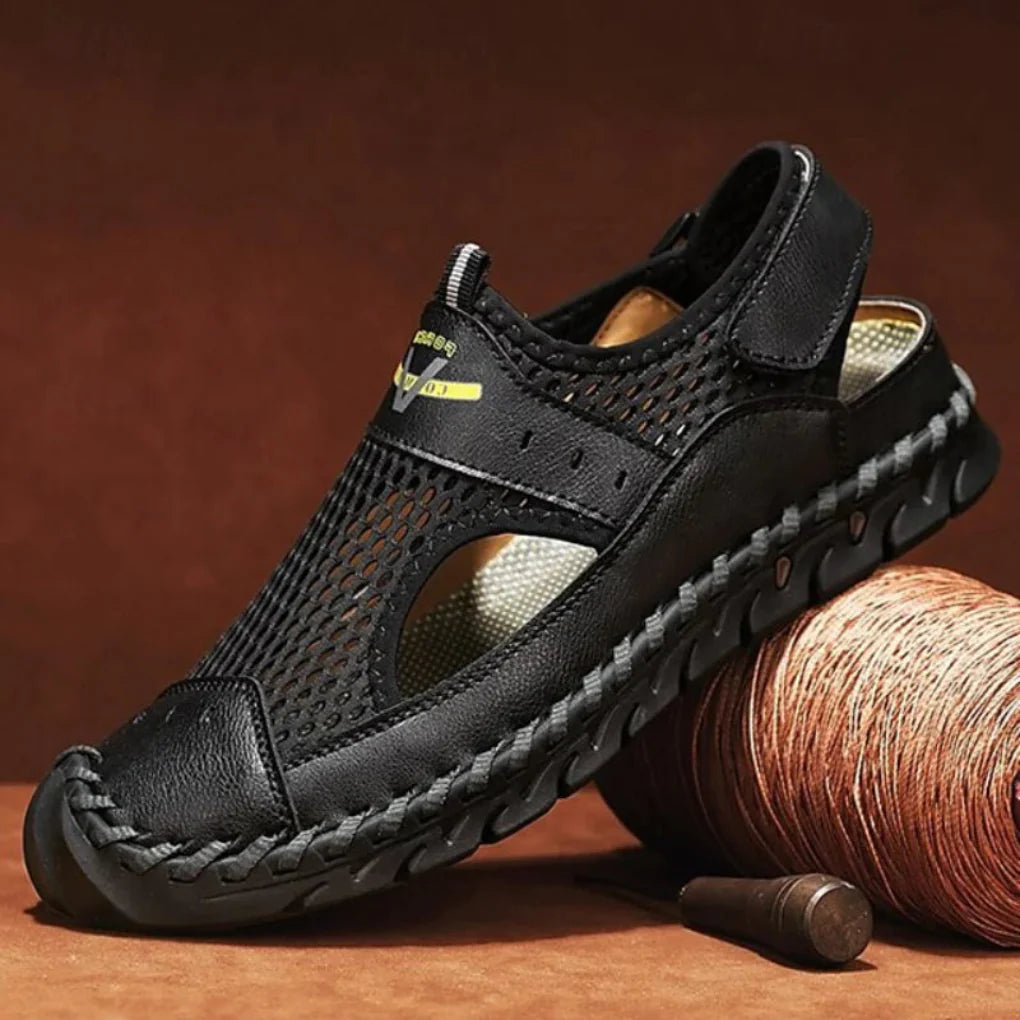 Close-up of men's black mesh comfort sandals, ergonomic orthopedic design for daily wear and support