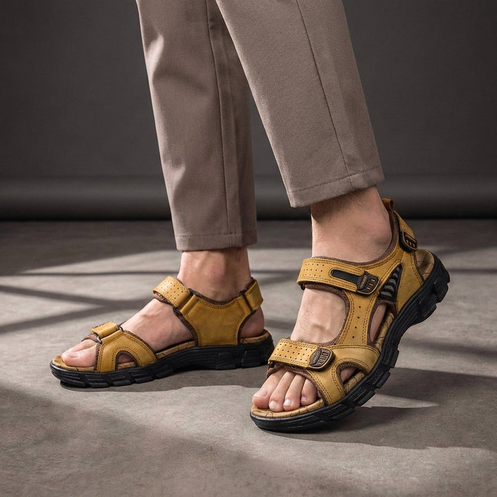 Comfortable men's orthopedic sandals with breathable perforated design, arch support & adjustable straps.