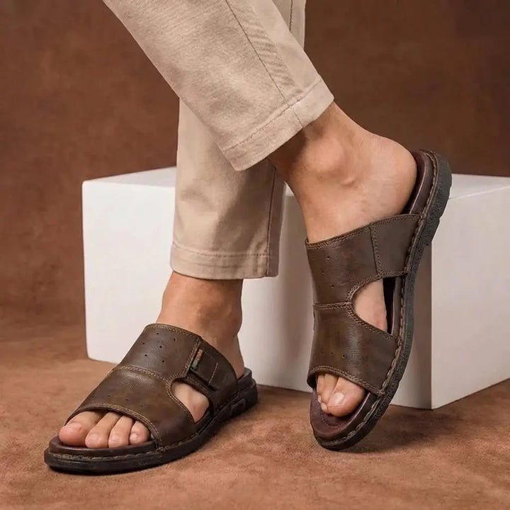 Black men's orthopedic slide sandals, designed for wide feet with superior arch support.