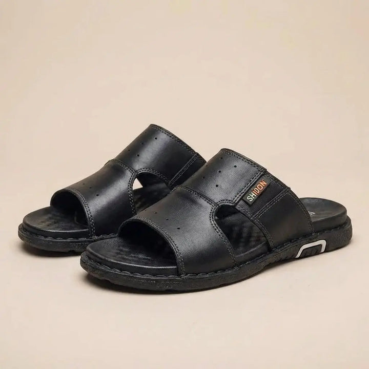 Men's orthopedic wide-fit slide sandals featuring durable construction and ergonomic comfort.