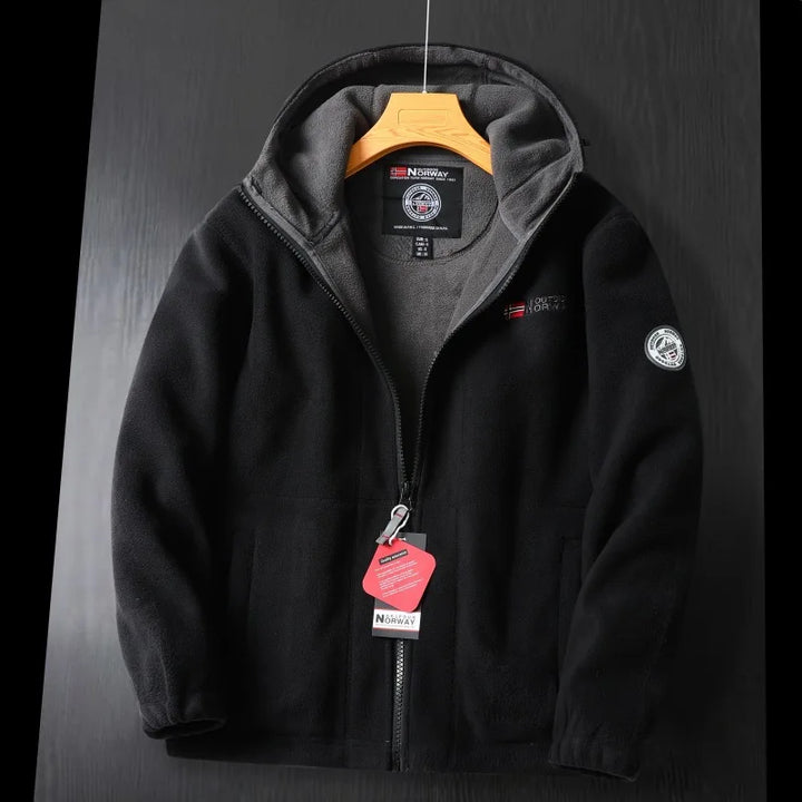 Close-up of fabric on a men's outdoor warm hooded fleece jacket, soft and durable outerwear.