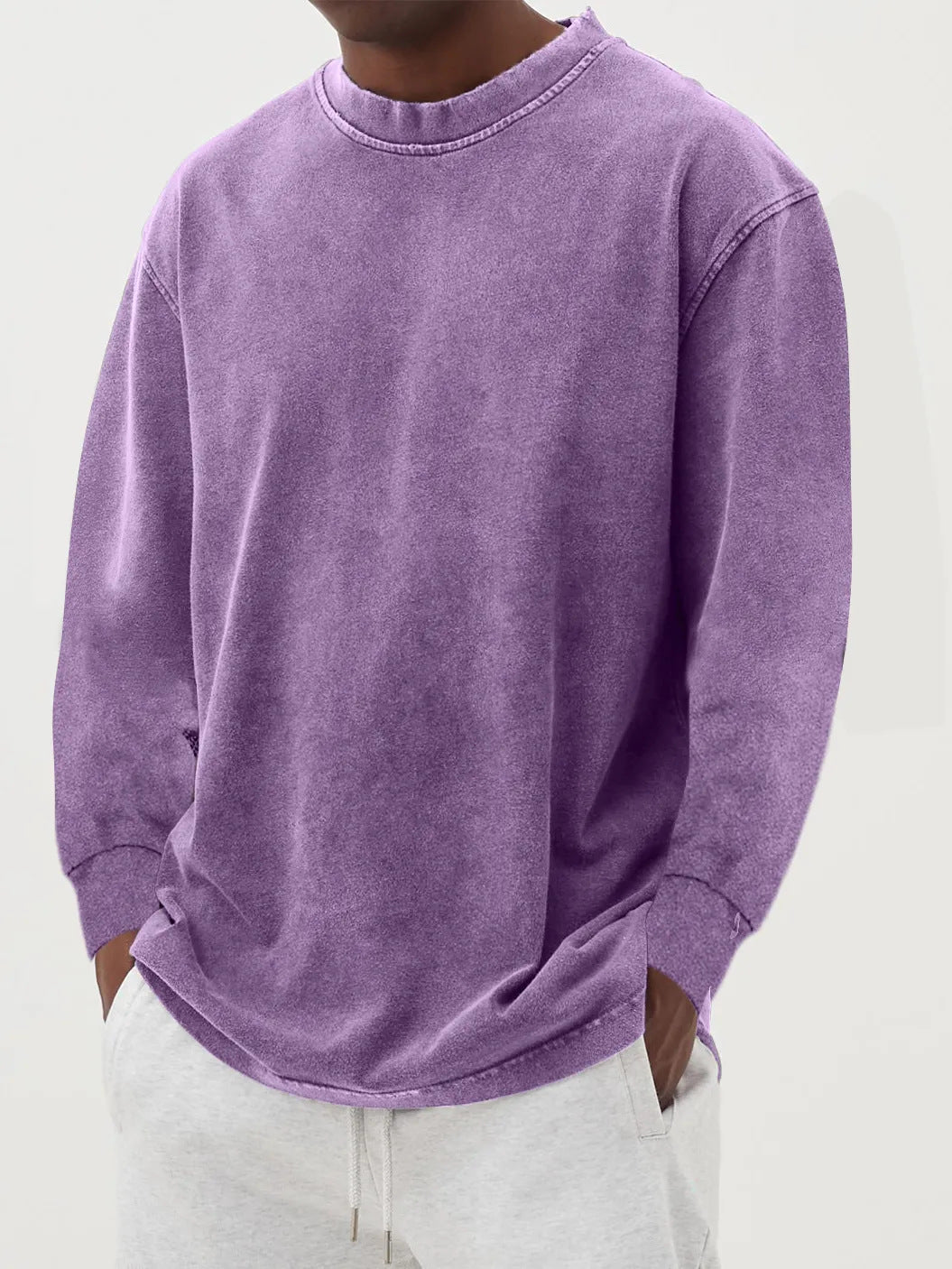 Side view of a men's oversized crewneck sweater, showcasing its generous relaxed fit and casual drape.