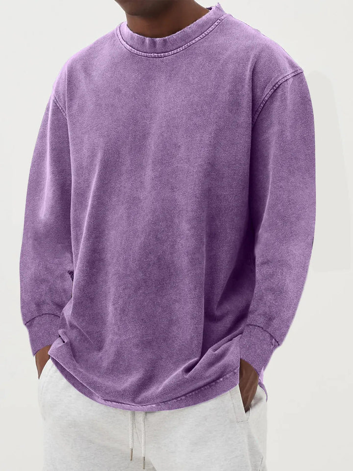 Side view of a men's oversized crewneck sweater, showcasing its generous relaxed fit and casual drape.