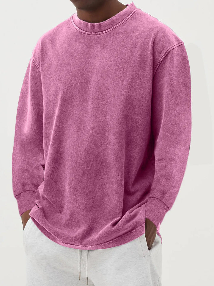 Close-up of soft fabric on men's oversized crewneck sweater, showing quality for relaxed casual wear.