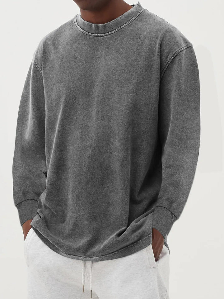 Man wearing a stylish oversized crewneck sweater, creating a relaxed casual look for everyday.