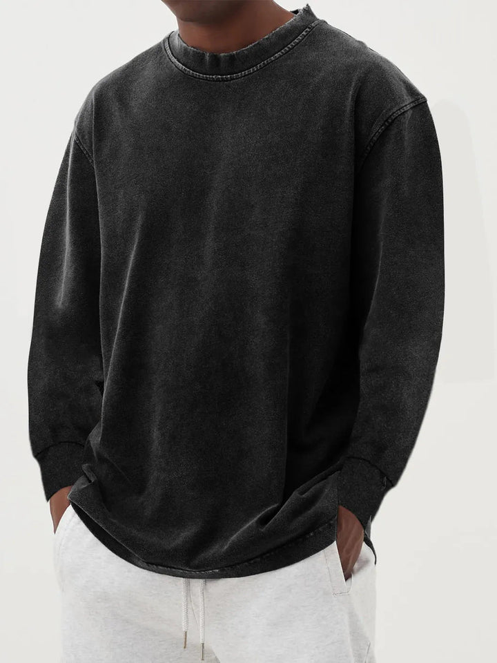 Black men's oversized crewneck sweater with relaxed fit, great for casual winter and leisure fashion.