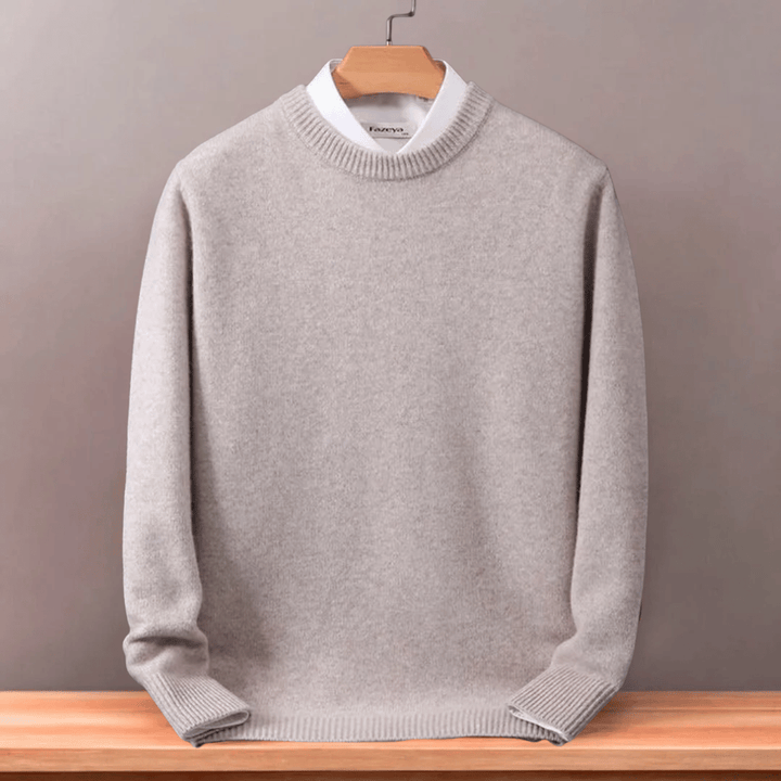 Model wearing a men's oversized wool blend sweater with an o-neck, showcasing winter fashion