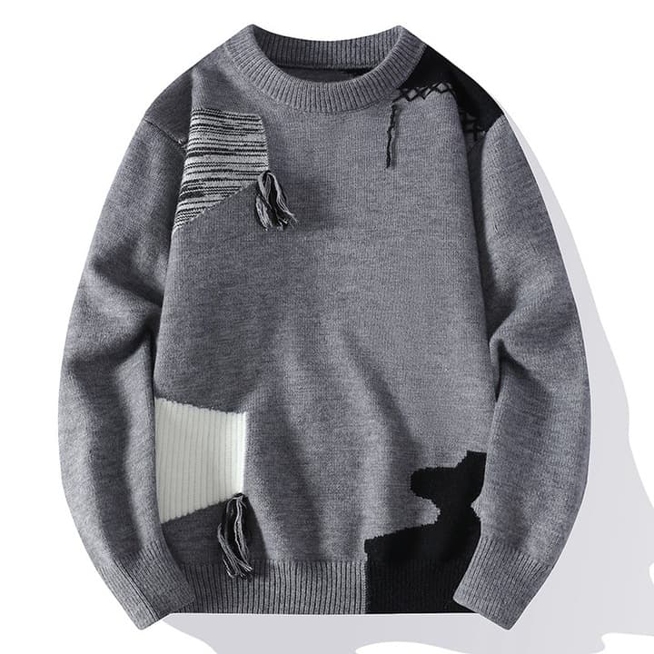 Comfortable men's oversized patchwork sweater with distressed accents, ideal for layering and unique style.