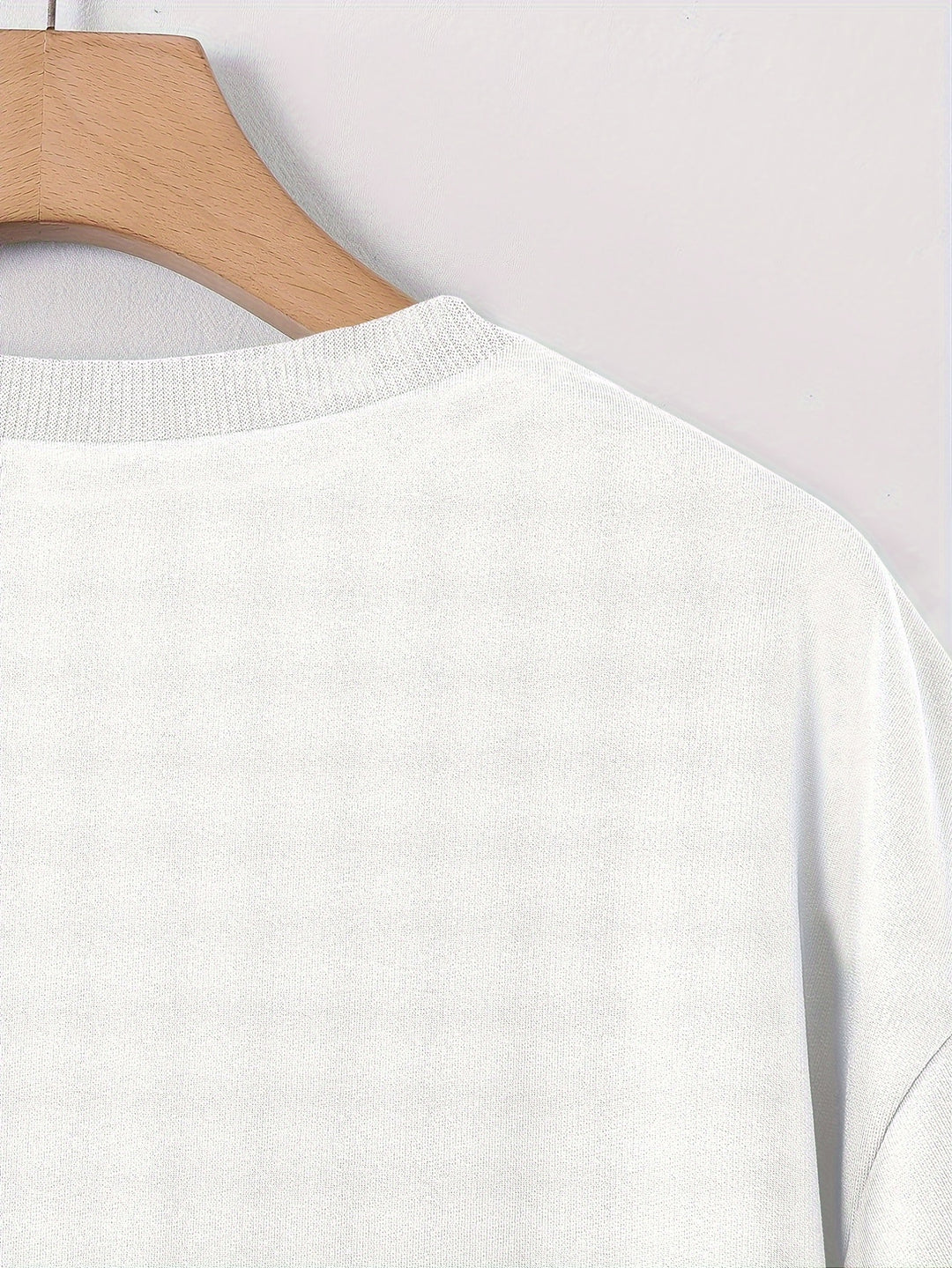 Comfortable men's streetwear tee with a vibrant rose graphic, offering a trendy loose fit for summer.