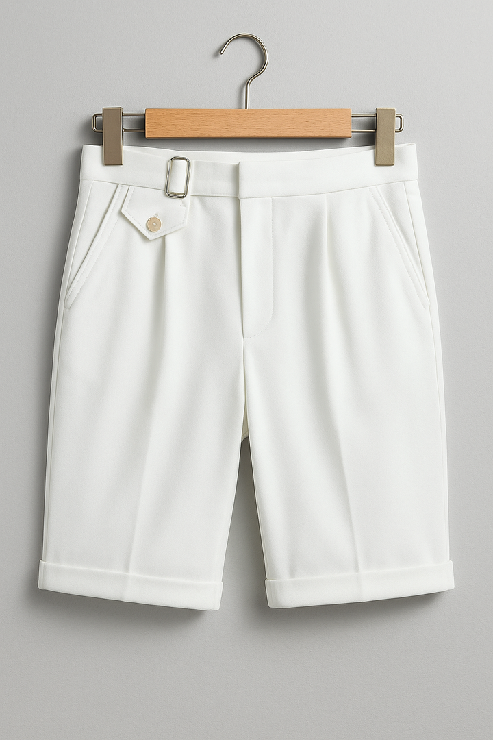 Close-up of side buckle on men's pleated tailored shorts, highlighting quality and sophisticated detail
