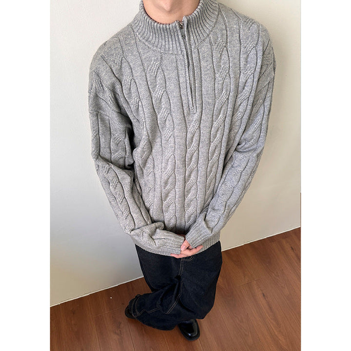 Warm men's cable knit quarter-zip sweater. Cozy knitwear for stylish fall and winter comfort.