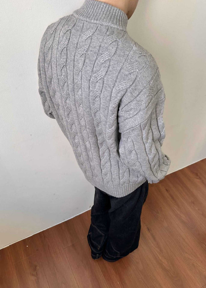 Classic men's mock neck quarter-zip sweater. Cable knit pullover, perfect for casual layering.