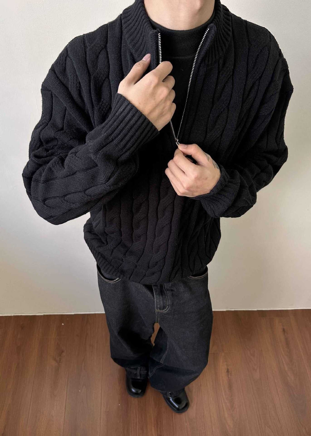 Men's quarter-zip pullover sweater. Elegant cable knit design, ideal for a smart casual look.