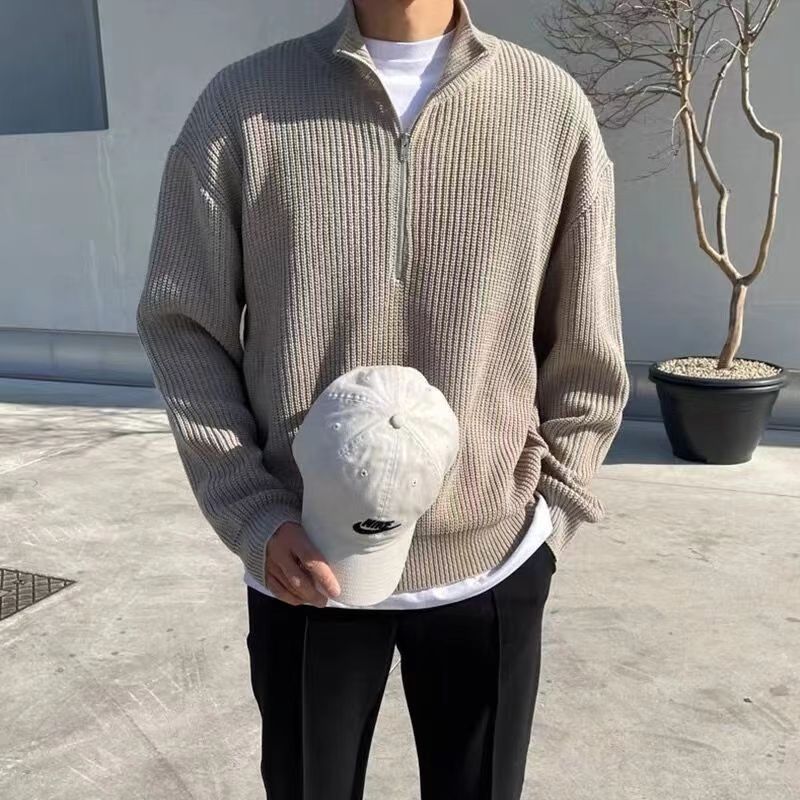Stylish men's quarter-zip sweater, featuring a textured ribbed knit. A versatile long sleeve pullover for modern casual fashion.