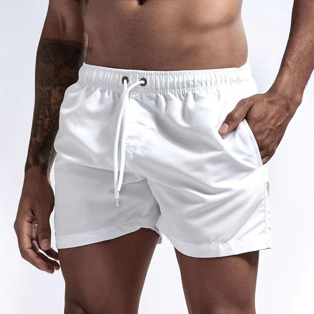 Close-up of Quick-Dry Men's Swim Shorts fabric, showing water-repellent texture for active wear