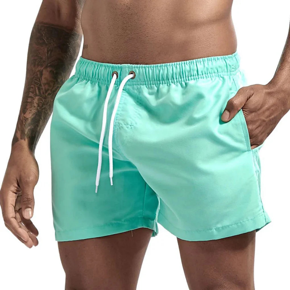Folded Quick-Dry Men's Swim Shorts, showcasing lightweight fabric for travel and summer apparel