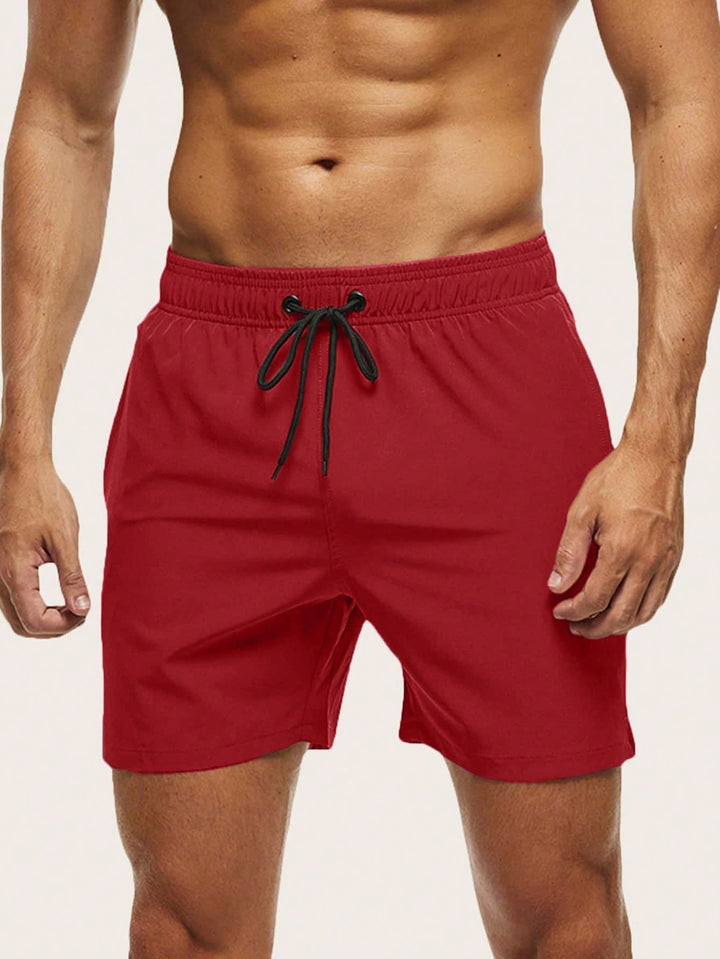 Men's quick-dry swim shorts, lightweight & stretch, perfect for beach, pool, or summer holiday.