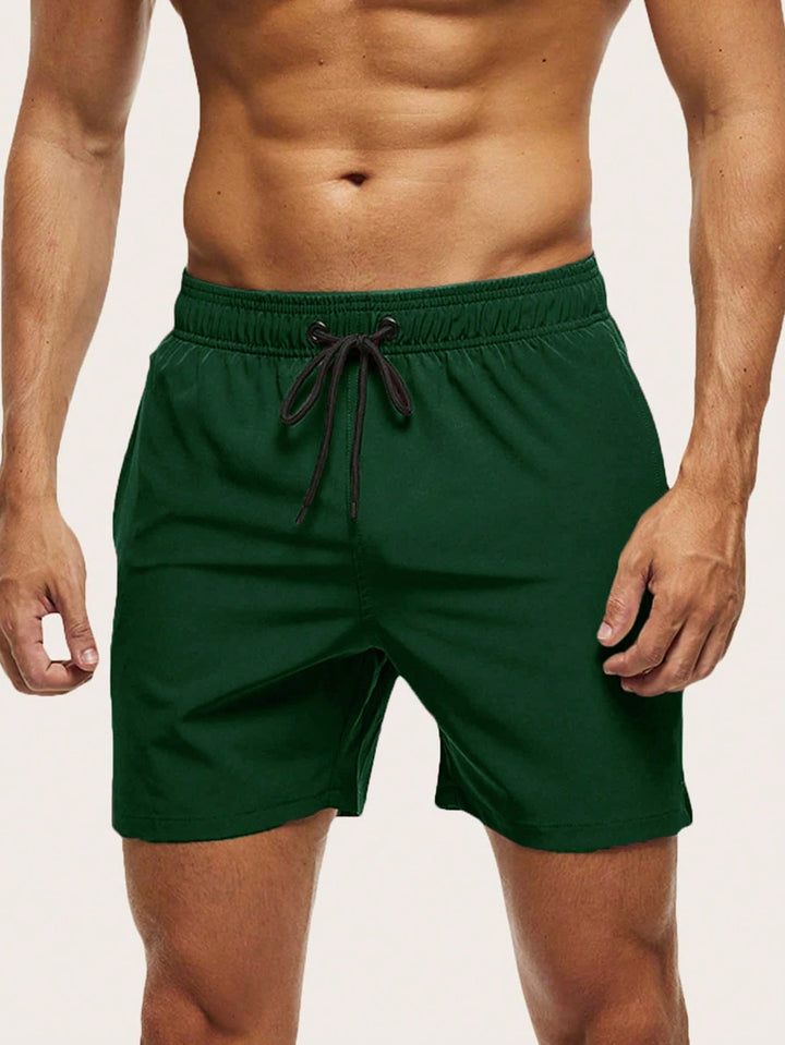 Comfortable men's quick-dry swim shorts, ideal lightweight stretch apparel for summer beach & pool.