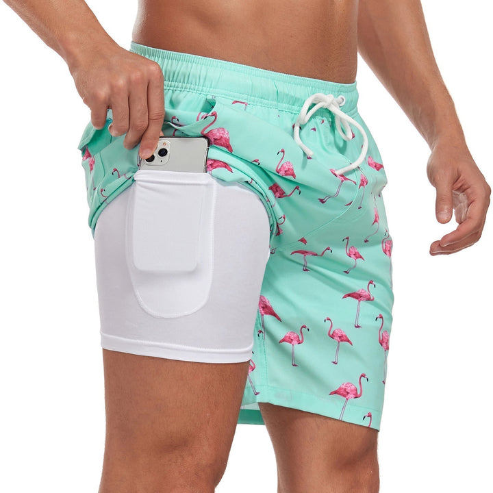 Athletic men's quick-dry swim shorts with built-in compression liner, great for active wear & swimwear.