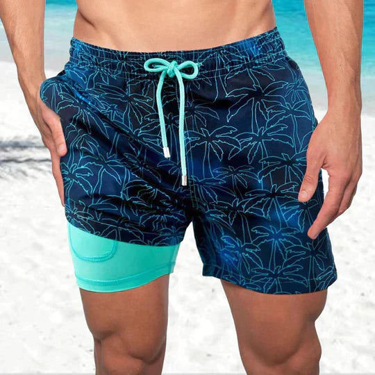 Men's tropical print quick-dry swim shorts with supportive compression liner, essential summer beachwear.
