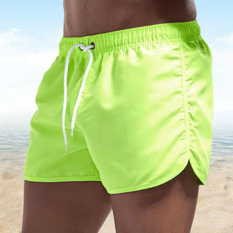 Stylish men's summer quick-dry swim trunks, ideal for beach, activewear, and poolside. Drawstring waist.