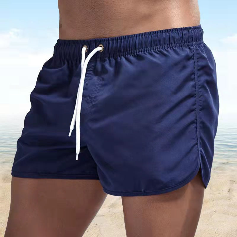 Durable men's quick-dry swim trunks, versatile as beach shorts & activewear. Elastic drawstring waist.