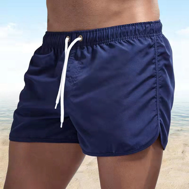 Durable men's quick-dry swim trunks, versatile as beach shorts & activewear. Elastic drawstring waist.