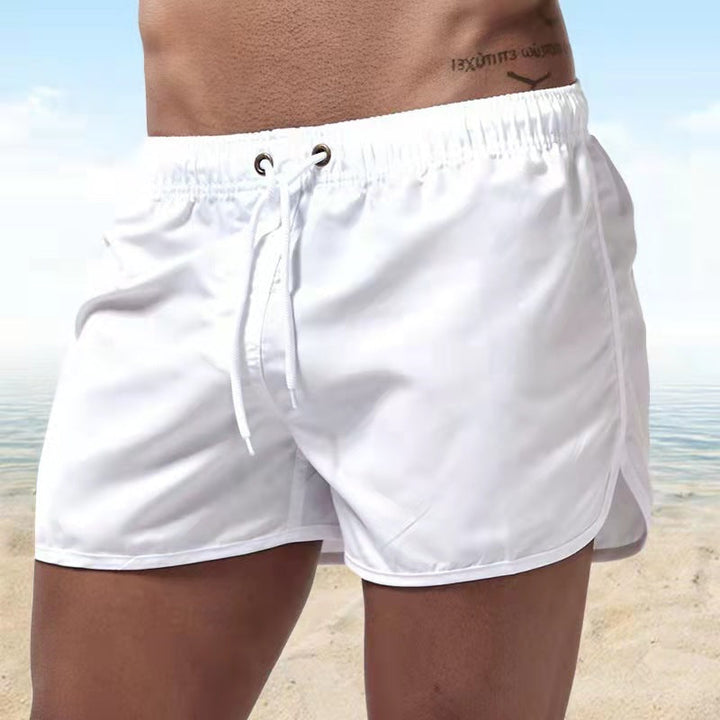 Men's quick-dry swim trunks for summer, featuring elastic waist & drawstring. Perfect for poolside vacation.