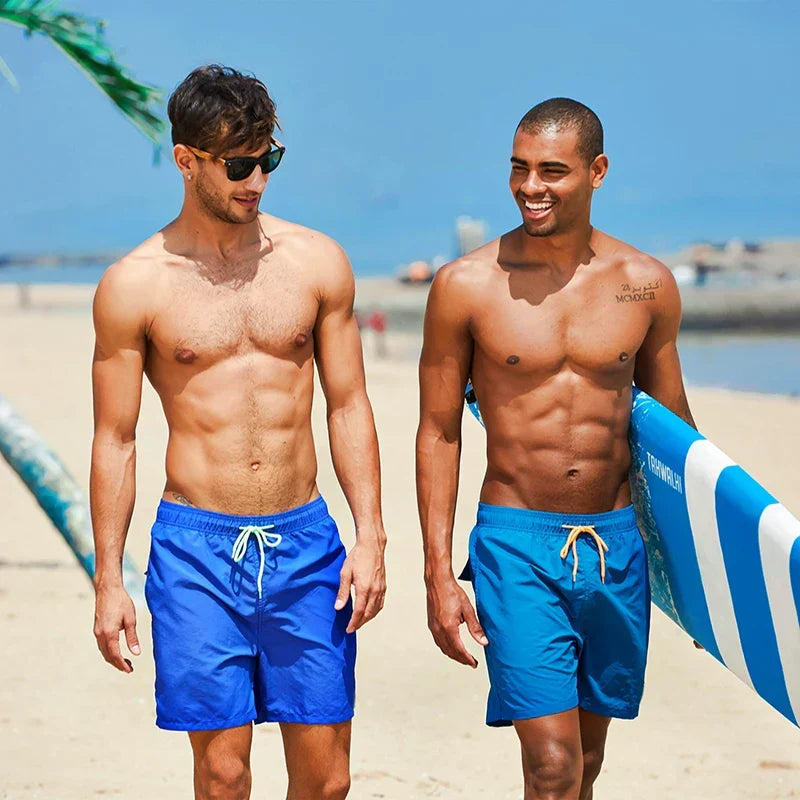 Modern men's quick-drying swim shorts with adjustable waist, perfect for sporty summer style.