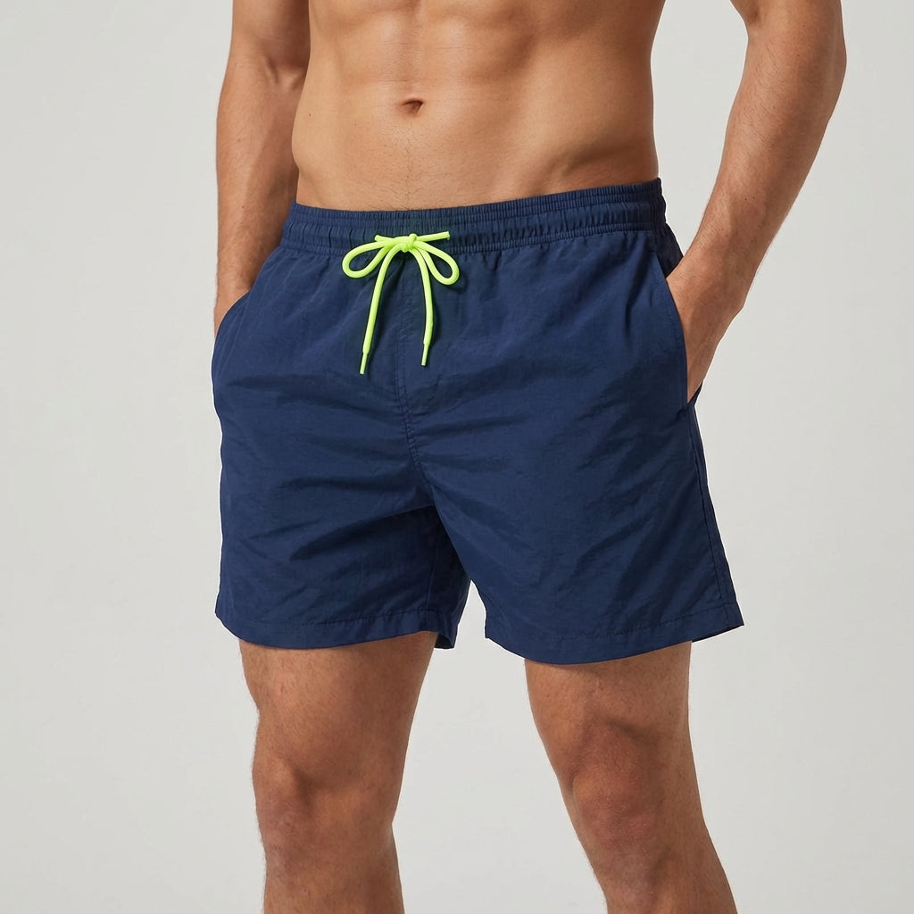 Comfort fit men's beach shorts, quick-drying fabric, ideal for active poolside wear.