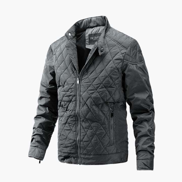 Man wearing a men's quilted casual bomber jacket, showcasing its clean lines and practical design.