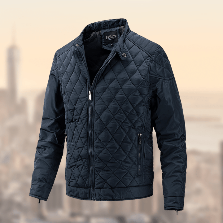 Men's quilted lightweight bomber jacket with stand collar and zip-up closure. Available in navy, black, olive, maroon.