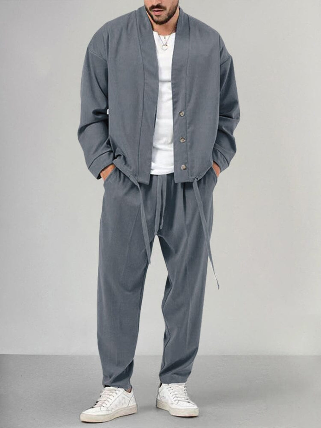 Stylish men's knit 2-piece track suit with relaxed fit, ideal for home comfort, travel, or casual wear.