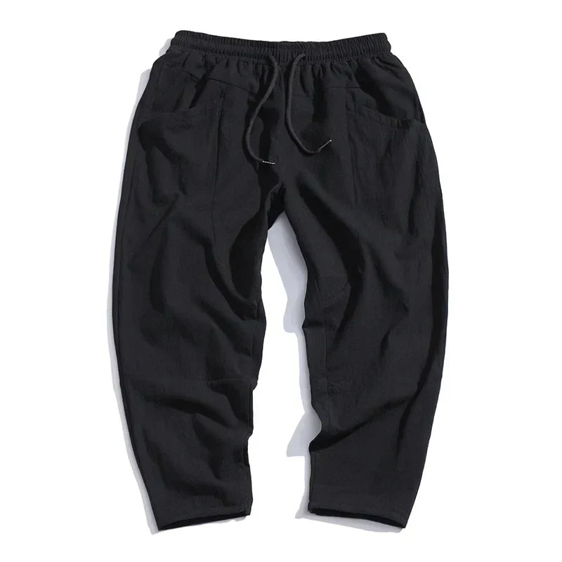 Versatile men's ankle-length relaxed fit pants, a key piece for smart casual and comfortable summer fashion.