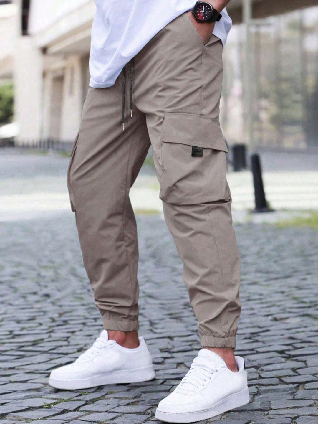 Model wearing men's relaxed fit olive cargo joggers, spring fashion, streetwear