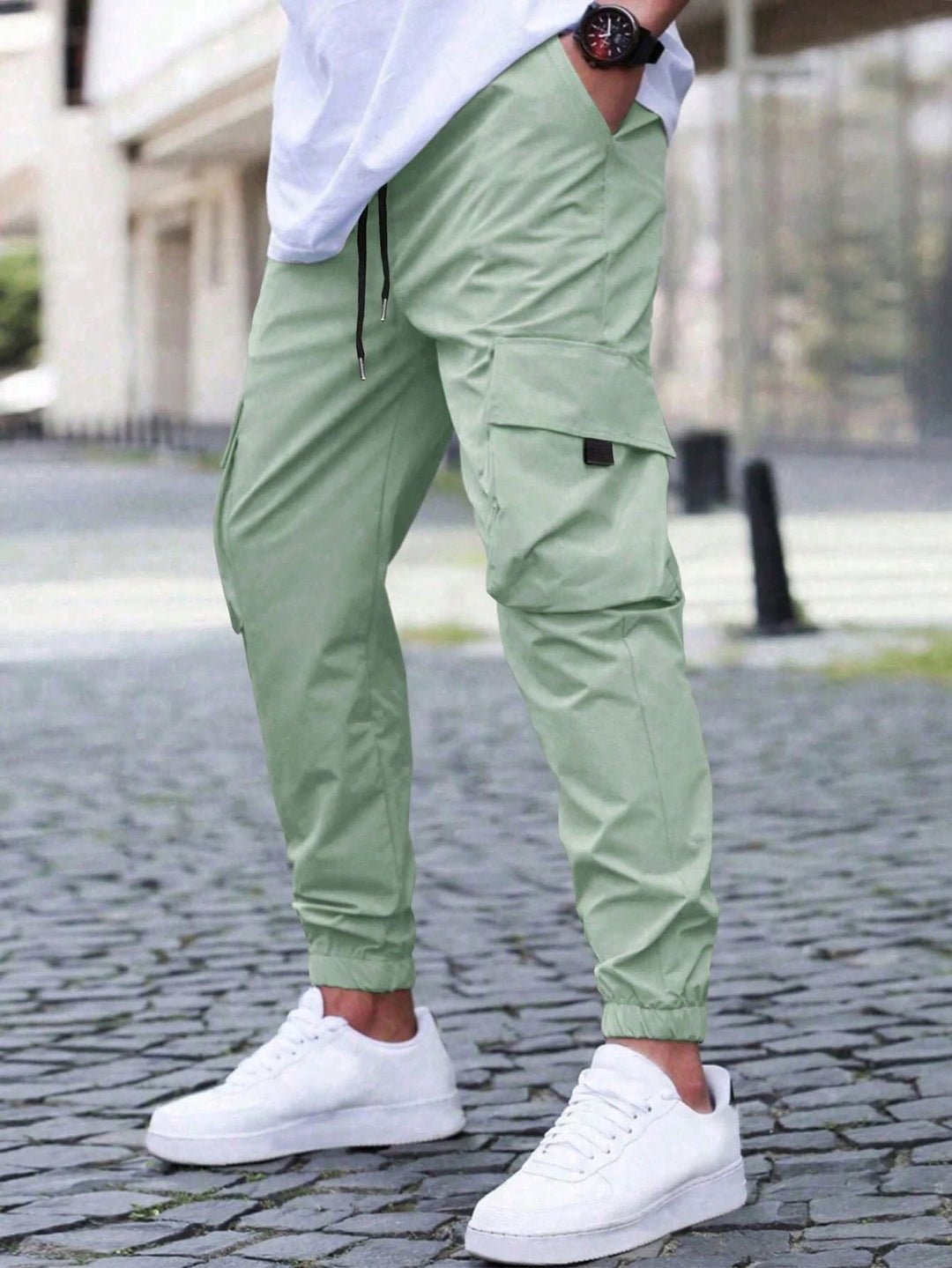Front view of men's relaxed fit cargo joggers in a light grey color, comfortable style