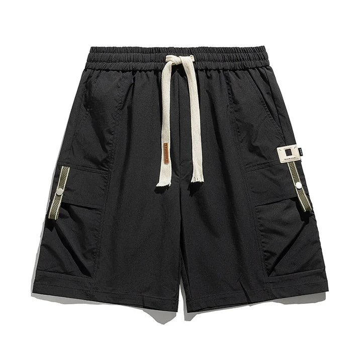 Practical men's utility cargo shorts featuring multiple pockets and a comfortable drawstring waist for spring/summer wear.