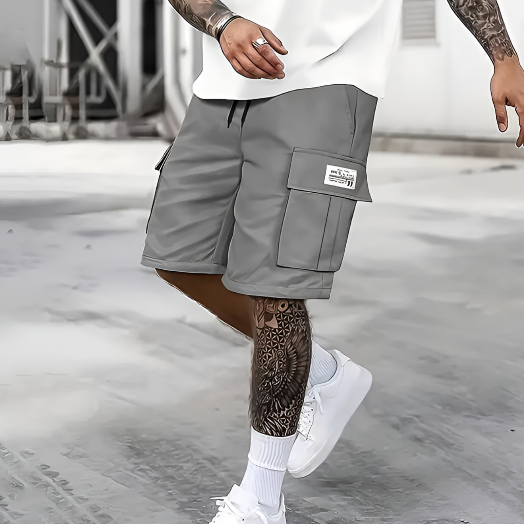 Men's relaxed fit cargo shorts with elastic waist, ideal for summer casual wear & adventure. Knee-length streetwear.