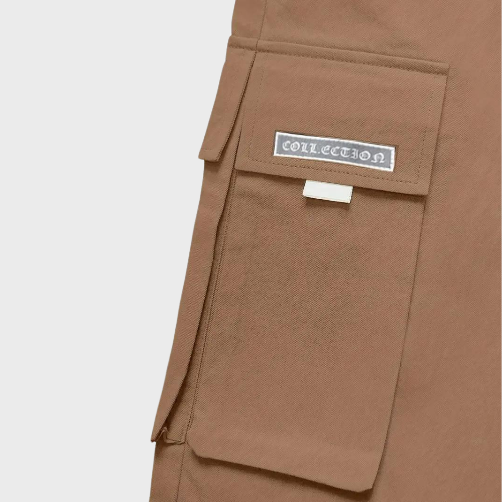 Stylish men's relaxed fit cargo trousers with drawstring waist, worn casually; perfect for urban exploration.